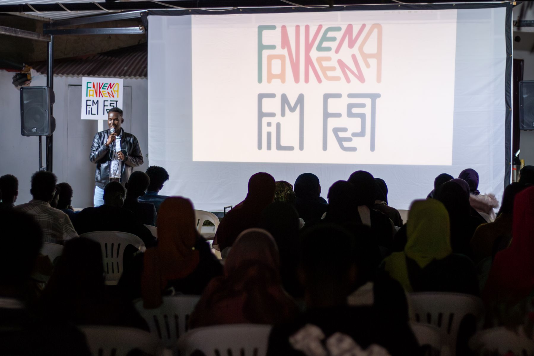 The audience in front of the screen showing the Fankeenna Film Fest logo