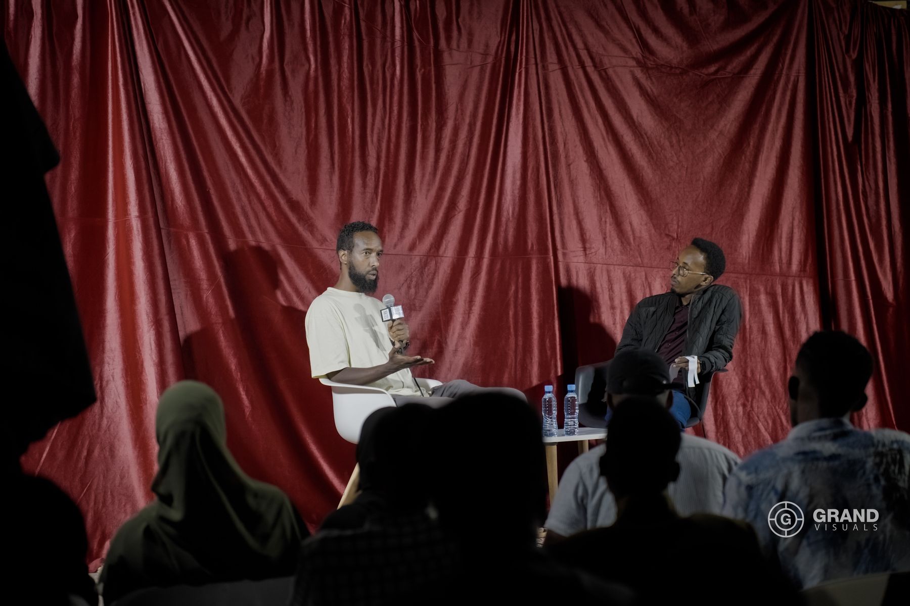 A panel talk on the red-curtain stage